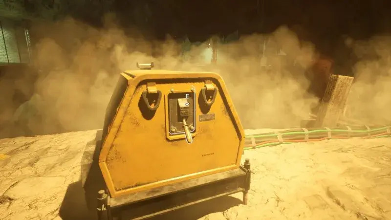 Yellow generator with a highlighted startup handle and bundled cables